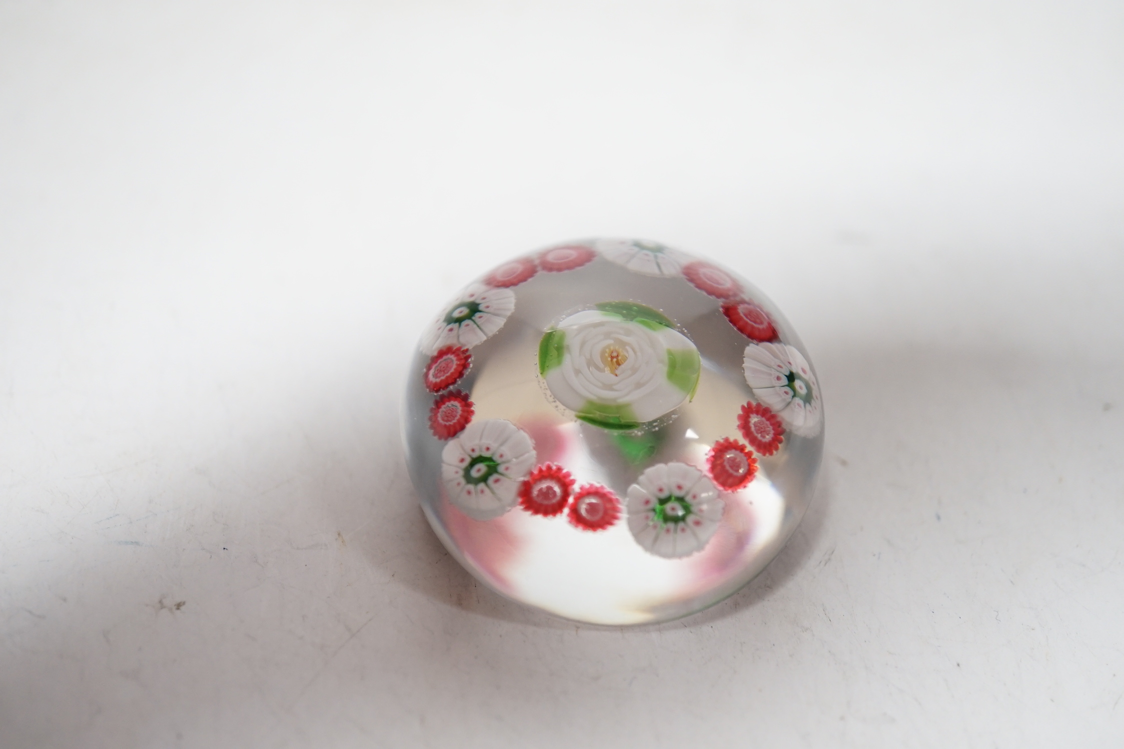 A Clichy green and white rose centred paperweight, 4cm in diameter